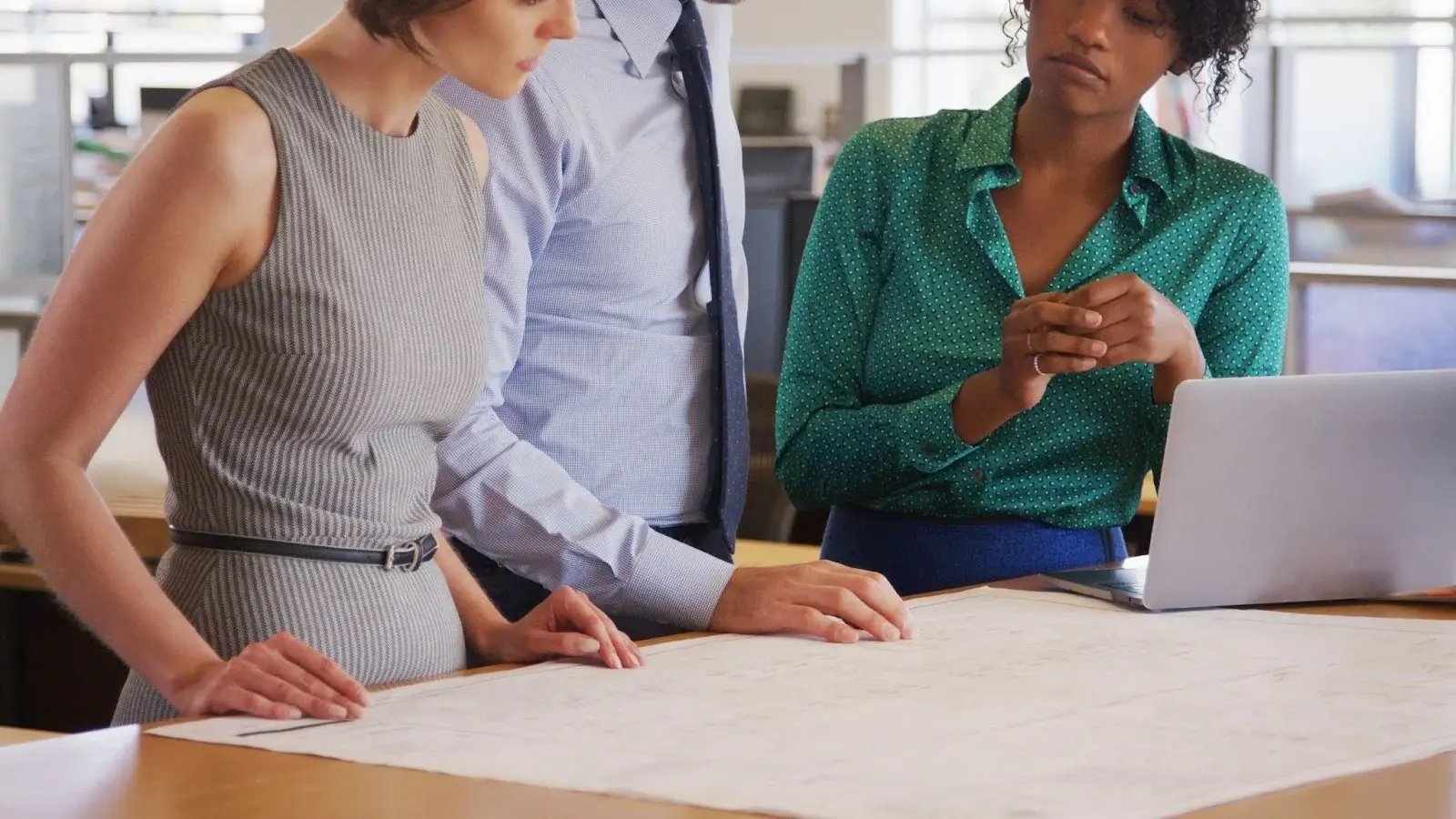 professionals reviewing event roi metrics