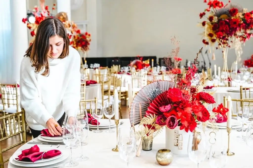 Woman Preparing Tables for Event in Large Room