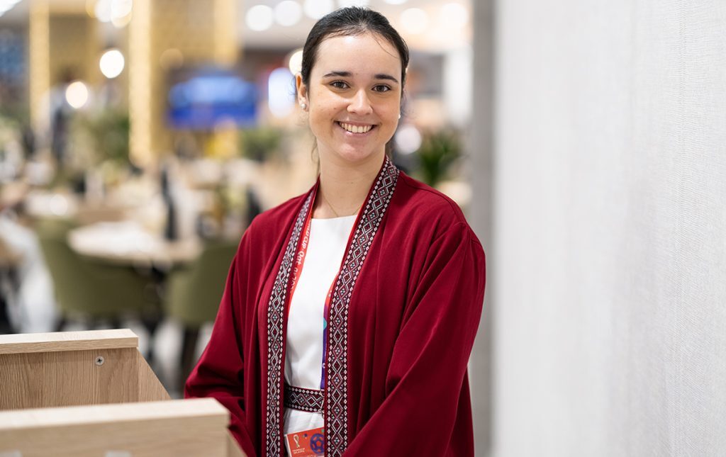 A hostess ready to welcome guests to a high profile sporting event